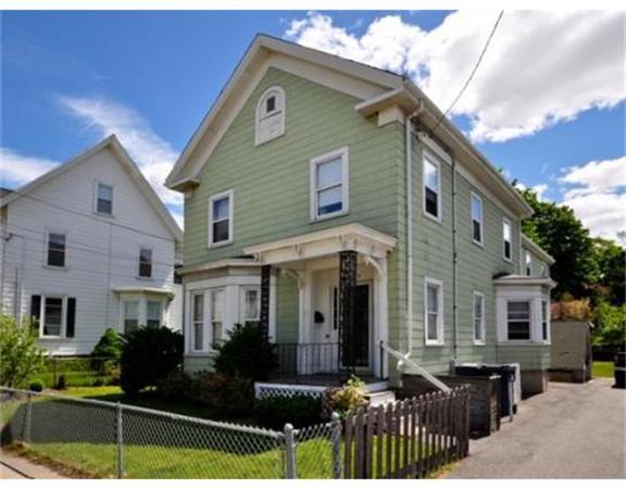 270 Spring Street Boston, MA 02132 - Photo 1 of 18 a front view of house with yard space and balcony