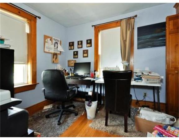 270 Spring Street Boston, MA 02132 - Photo 14 of 18 a view of a workspace with furniture and a window