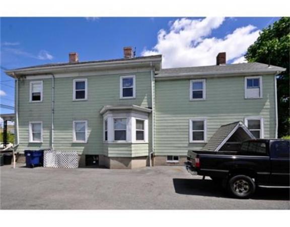 270 Spring Street Boston, MA 02132 - Photo 3 of 18 a front view of a house with parking space