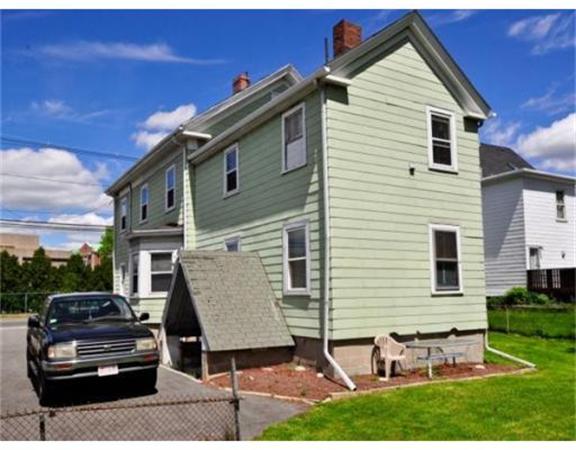 270 Spring Street Boston, MA 02132 - Photo 4 of 18 a view of a house with a yard and furniture