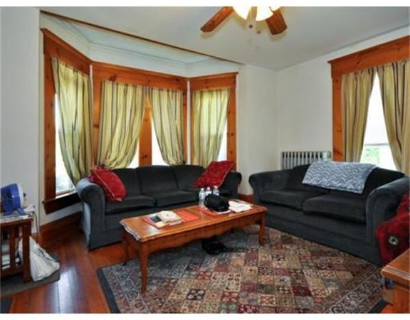 270 Spring Street Boston, MA 02132 - Photo 5 of 18 a living room with furniture and a window