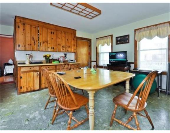 270 Spring Street Boston, MA 02132 - Photo 6 of 18 a table and chairs in a open kitchen