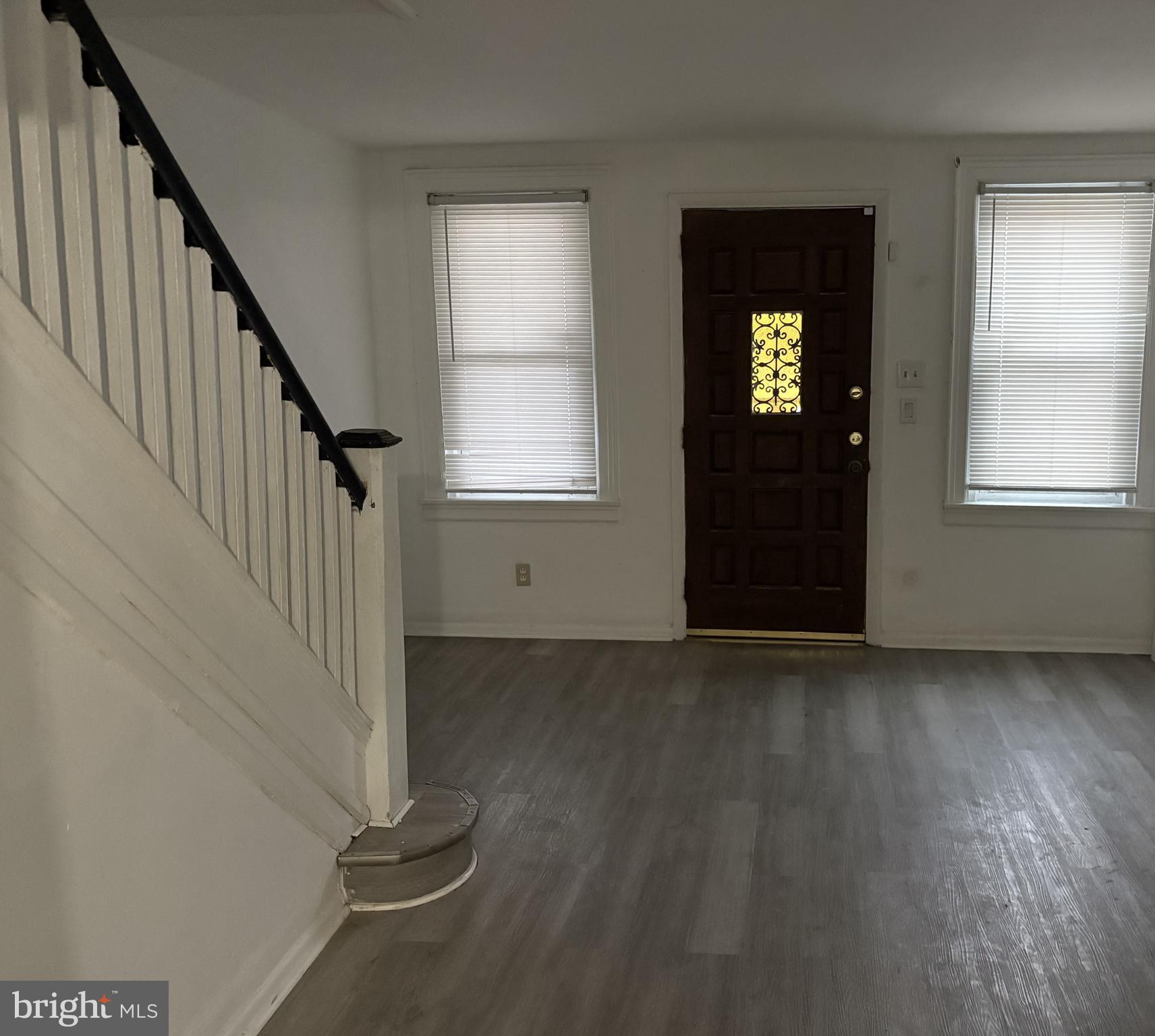 6380 Marsden Street Philadelphia, PA 19135 - Photo 5 of 9 an empty room with wooden floor closet and windows