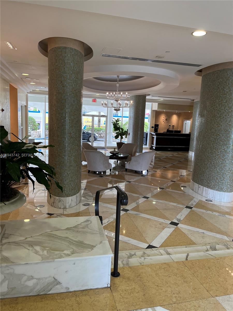 6917 Collins Avenue, Unit 426 Miami Beach, FL 33141 - Photo 14 of 15 a view of a room with gym equipment