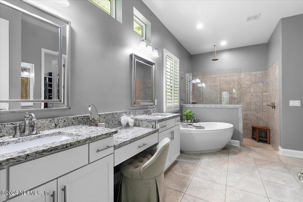 447 Glenneyre Circle St. Augustine, FL 32092 - Photo 14 of 44 a bathroom with a granite countertop sink mirror and toilet