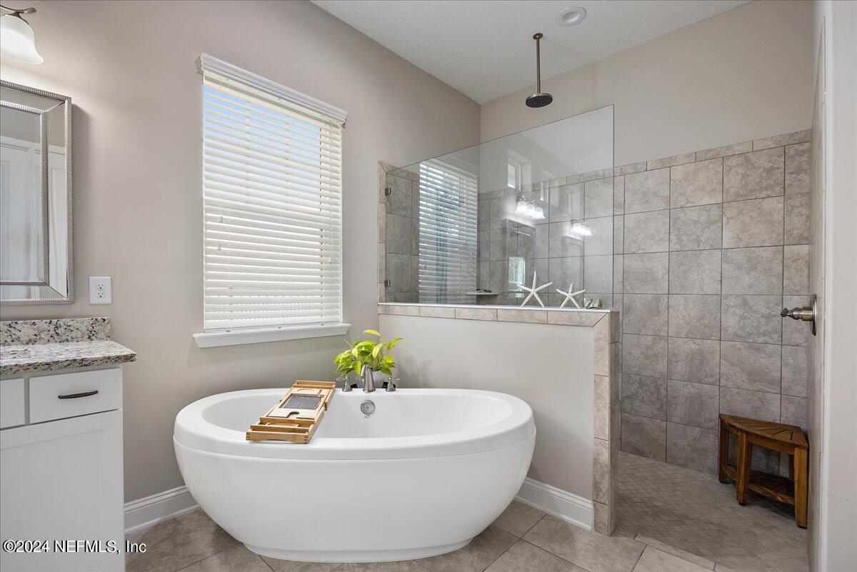 447 Glenneyre Circle St. Augustine, FL 32092 - Photo 15 of 44 a bath tub sitting in a bathroom next to a window