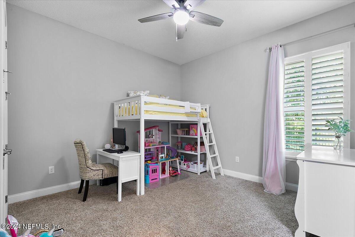 447 Glenneyre Circle St. Augustine, FL 32092 - Photo 18 of 44 a view of a room with workspace and windows