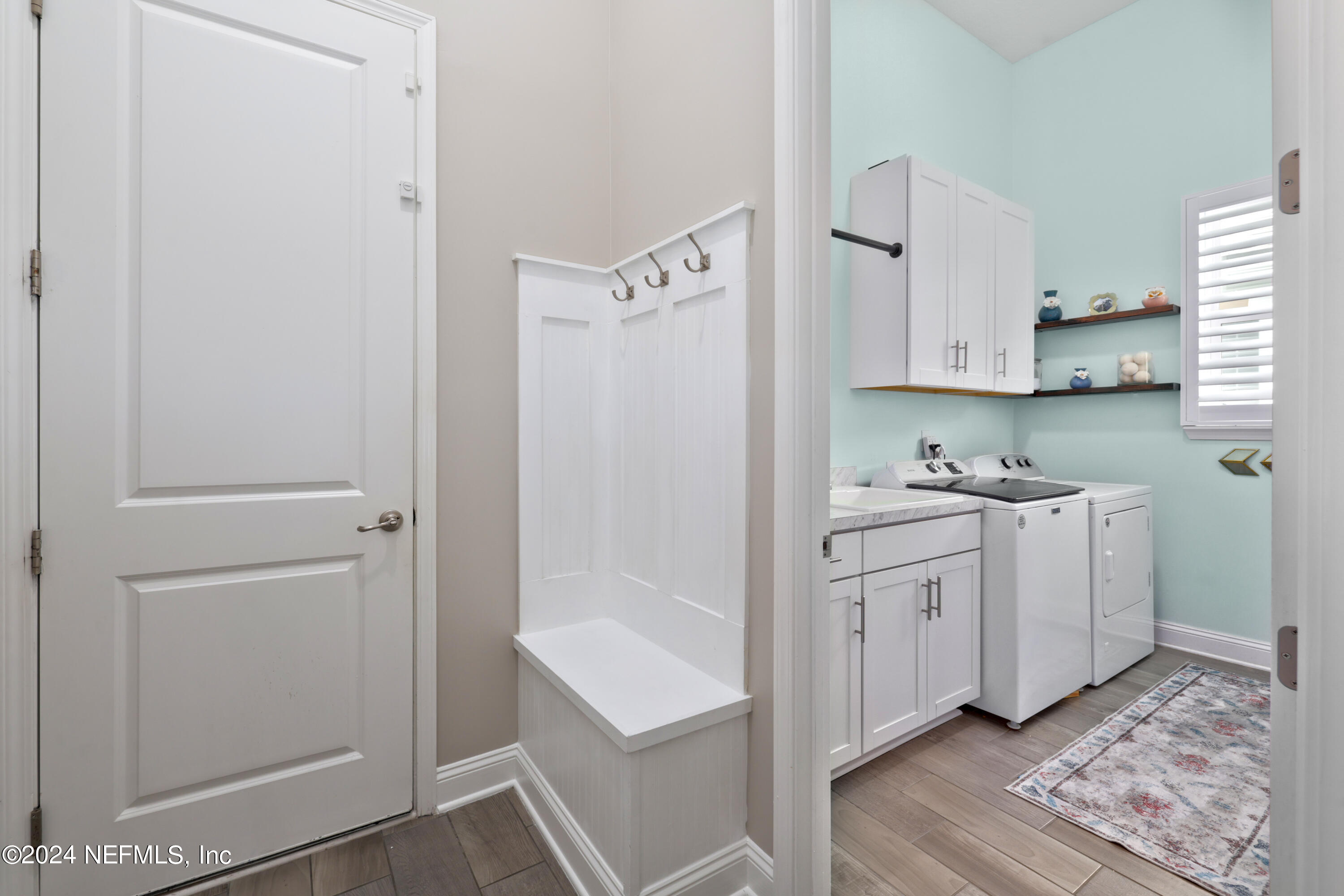 447 Glenneyre Circle St. Augustine, FL 32092 - Photo 20 of 44 a kitchen with white cabinets and refrigerator