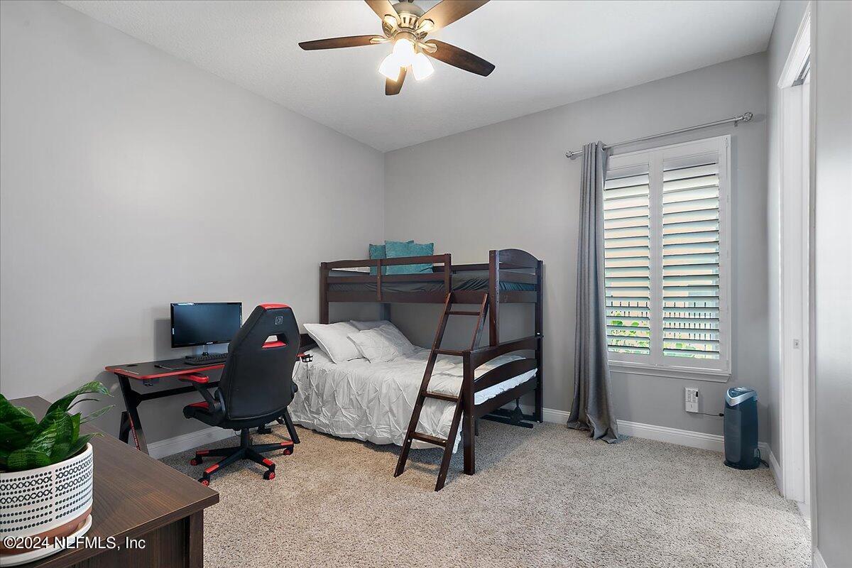 447 Glenneyre Circle St. Augustine, FL 32092 - Photo 22 of 44 a view of a workspace with furniture and a window