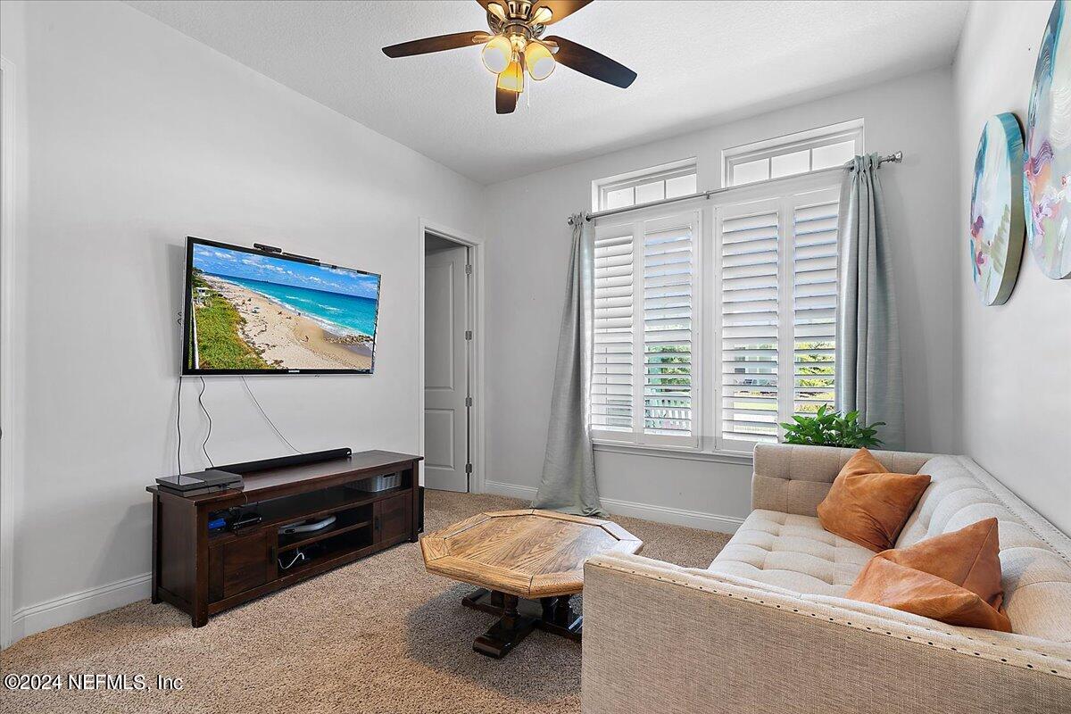 447 Glenneyre Circle St. Augustine, FL 32092 - Photo 24 of 44 a living room with furniture and a window