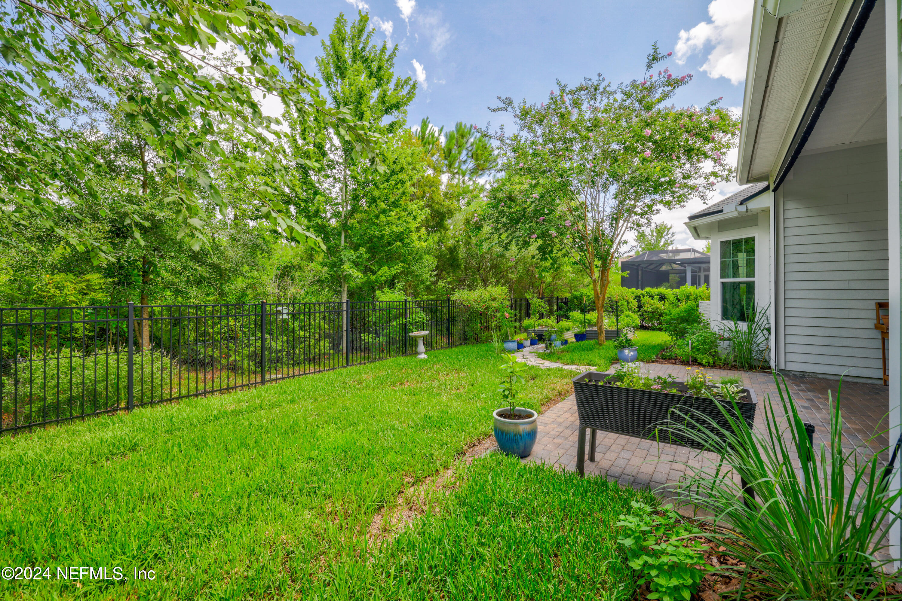 447 Glenneyre Circle St. Augustine, FL 32092 - Photo 27 of 44 a view of a chair and table in the garden