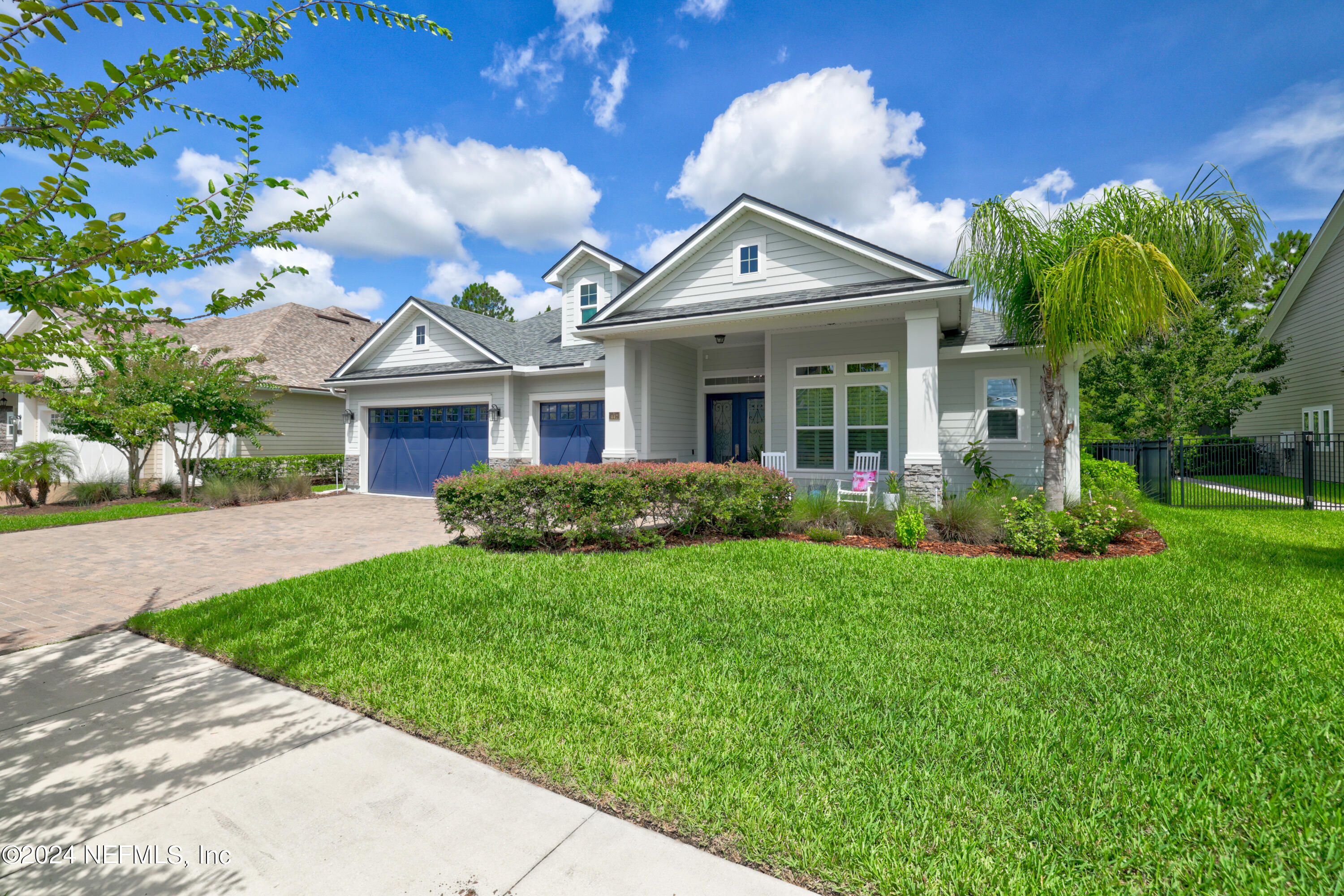 447 Glenneyre Circle St. Augustine, FL 32092 - Photo 3 of 44 a front view of a house with a garden
