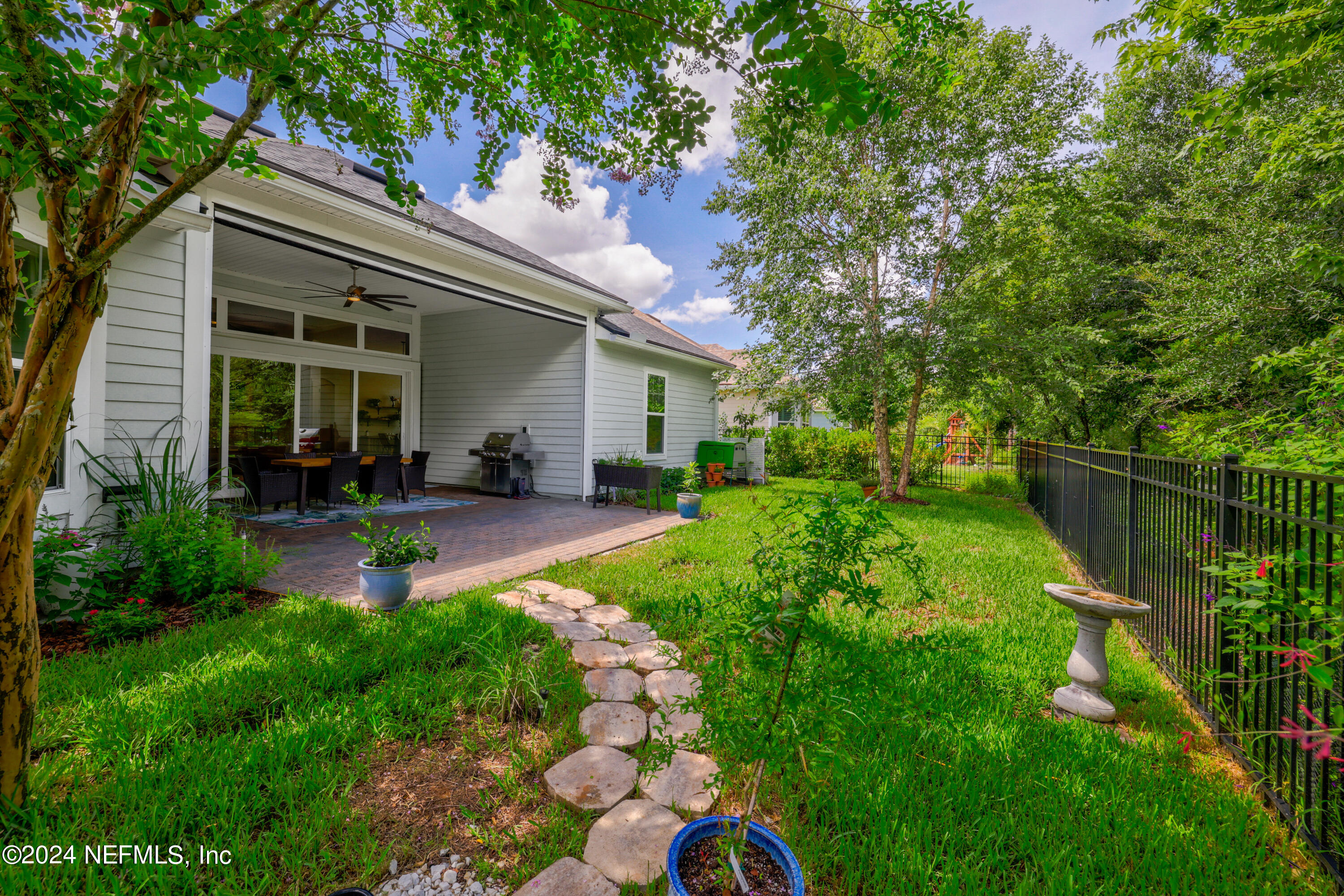 447 Glenneyre Circle St. Augustine, FL 32092 - Photo 33 of 44 a view of an house with backyard space and garden
