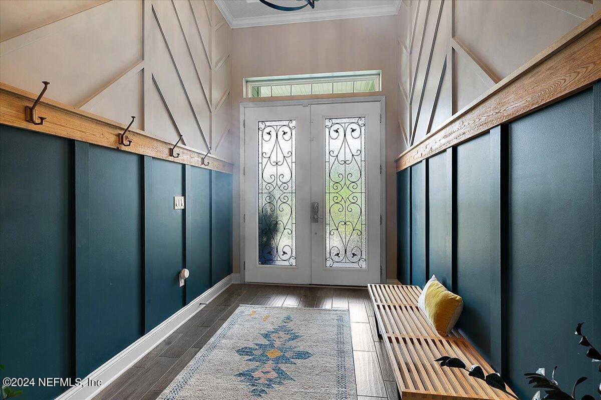 447 Glenneyre Circle St. Augustine, FL 32092 - Photo 5 of 44 a view of hallway with windows and stairs