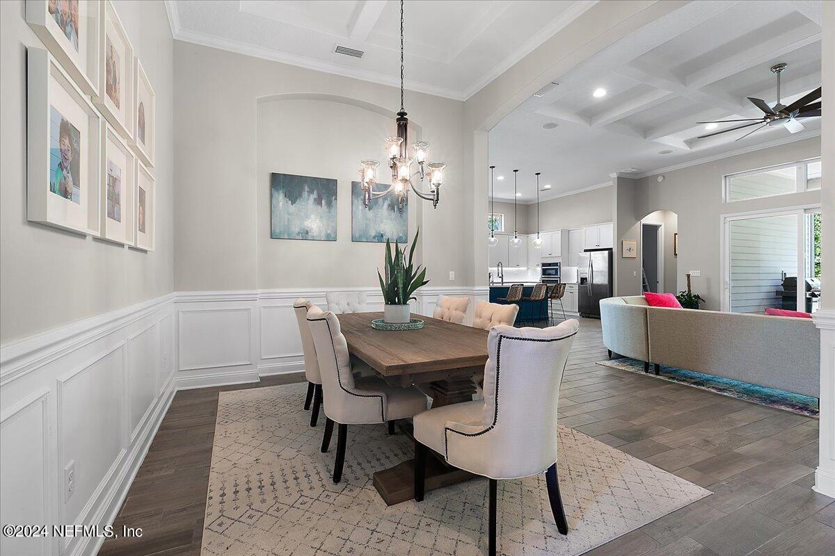 447 Glenneyre Circle St. Augustine, FL 32092 - Photo 6 of 44 a view of a dining room with furniture and chandelier