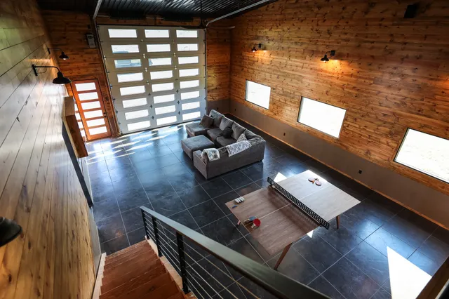 an outdoor space with pool and sitting space