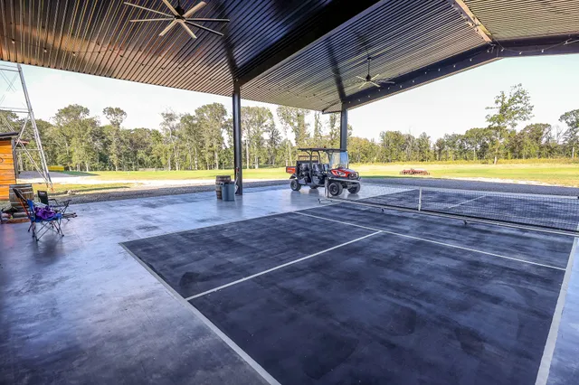 a view of a house with a yard and garage