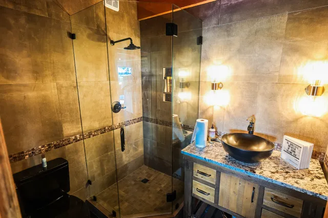 a view of a balcony with wooden floor and fence