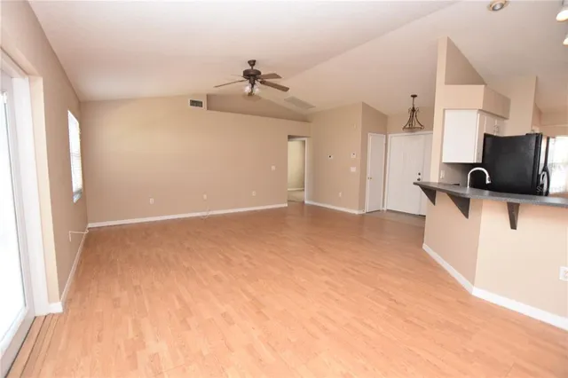 a view of a kitchen with a sink and cabinet