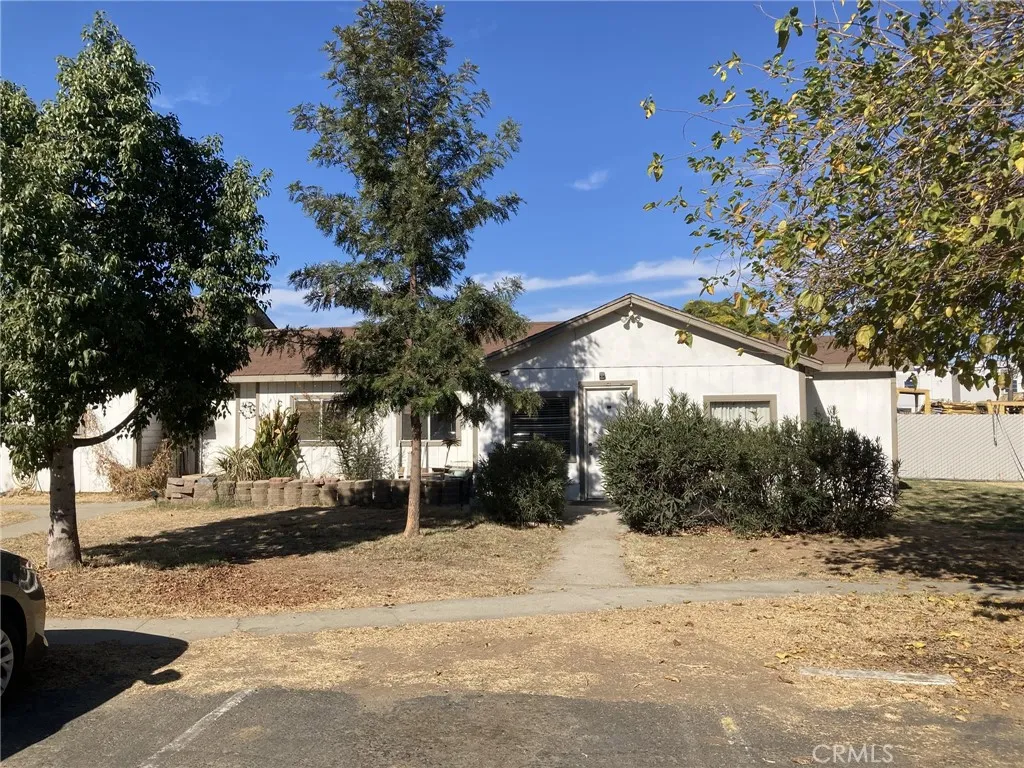 4439 Wade Avenue Perris, CA 92571 - Photo 7 of 11 a view of dirt yard and a large tree