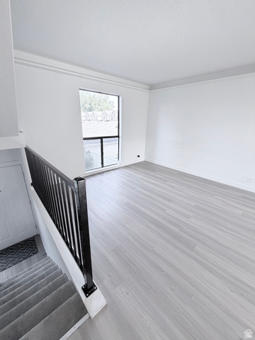 227 South West Lane Provo, UT 84601 - Photo 5 of 25 Open concept living area featuring light wood-finish flooring