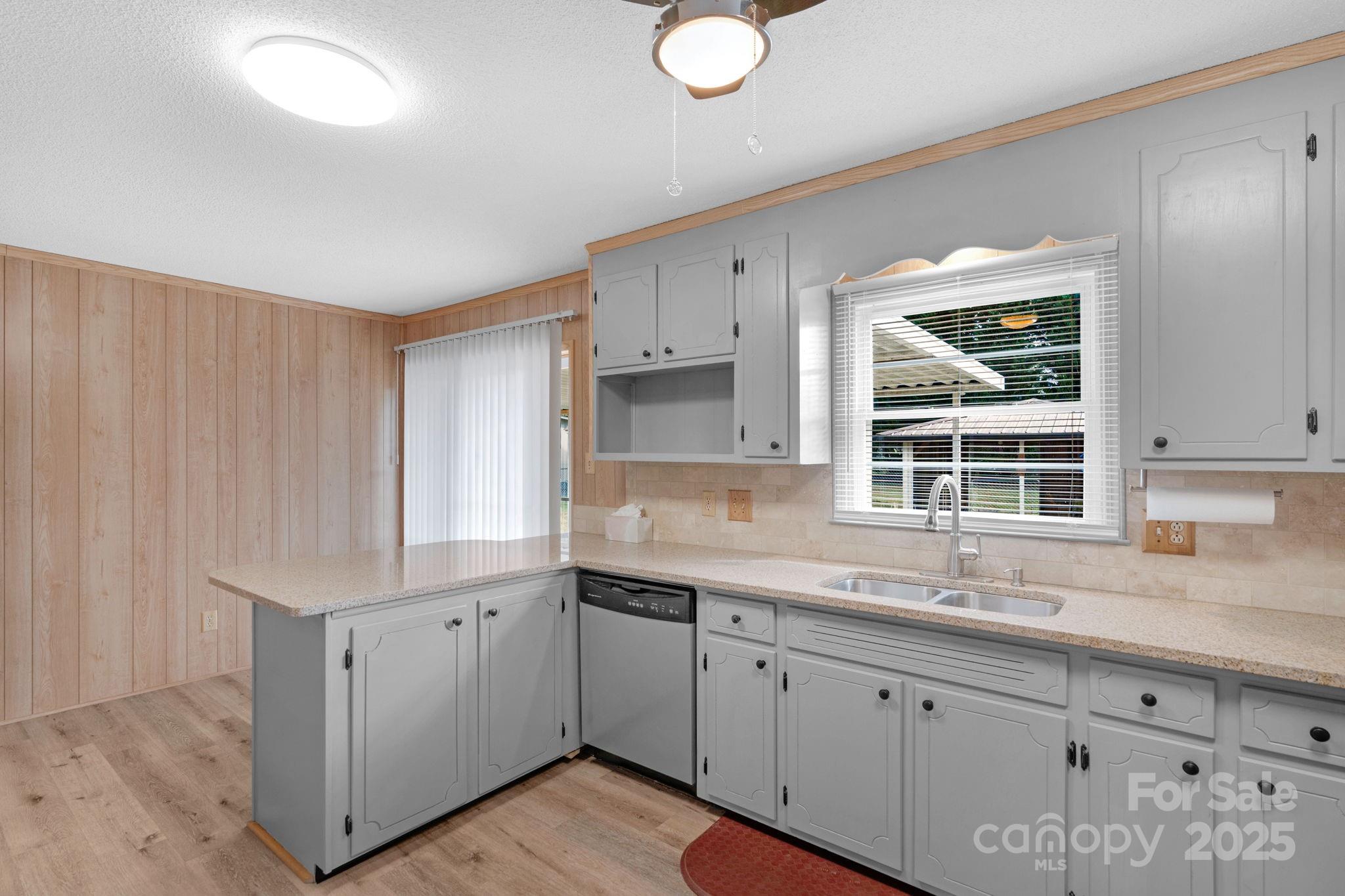 1202 Flowe Drive Matthews, NC 28104 - Photo 14 of 47 a kitchen with a sink cabinets and window