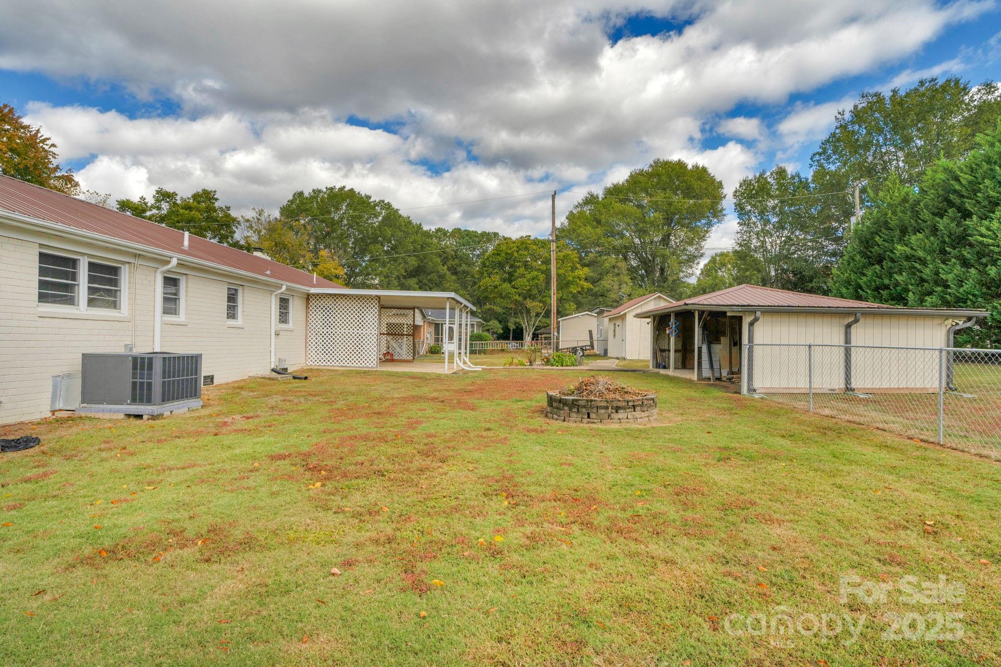 1202 Flowe Drive Matthews, NC 28104 - Photo 38 of 47 a view of a yard with a house