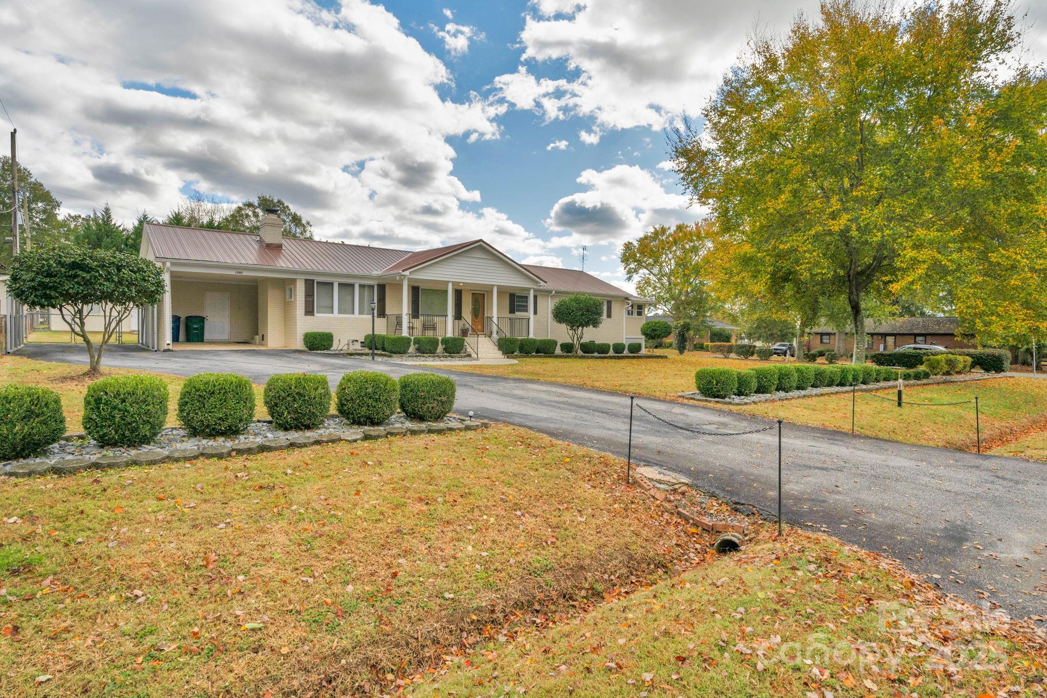 1202 Flowe Drive Matthews, NC 28104 - Photo 4 of 47 a view of a house with a swimming pool
