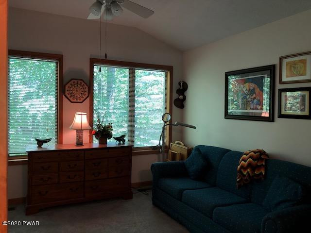 116 Maple Ridge Drive Hawley, PA 18428 - Photo 8 of 19 a living room with furniture and a large window