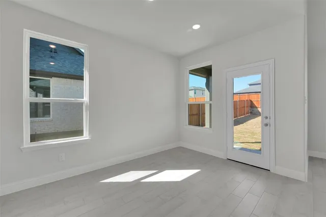 an empty room with windows