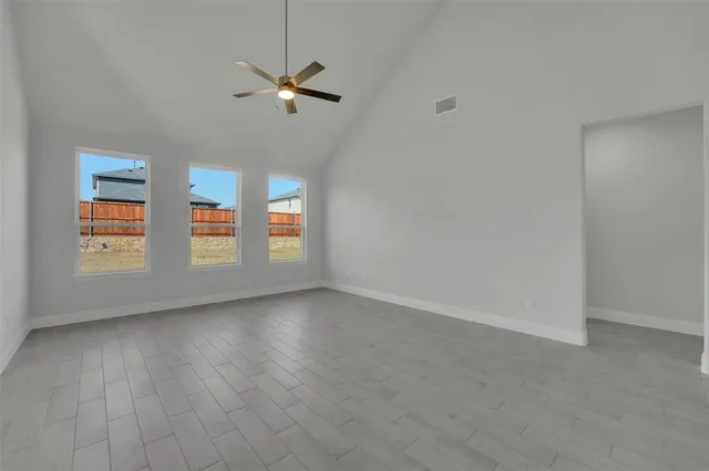 a view of an empty room with a window