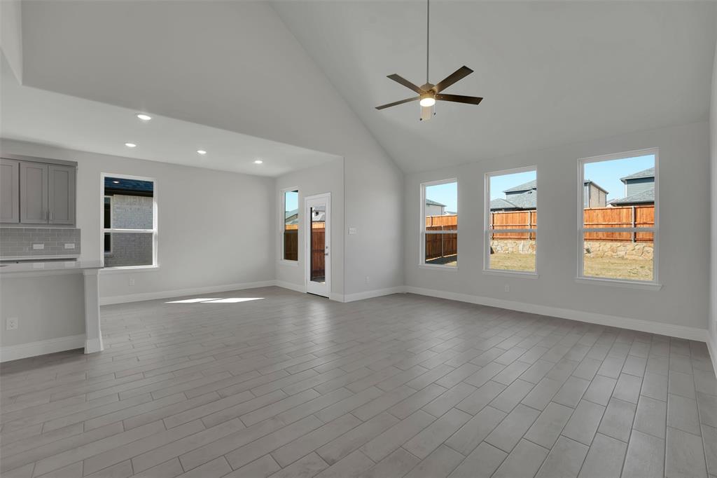 3112 Giovanni Point Princeton, TX 75407 - Photo 16 of 37 a view of an empty room with window and wooden floor