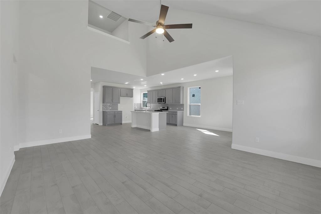 3112 Giovanni Point Princeton, TX 75407 - Photo 17 of 37 a view of an empty room and kitchen view