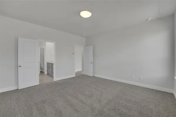 a view of an empty room with a fan
