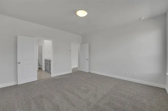 a view of an empty room with a fan