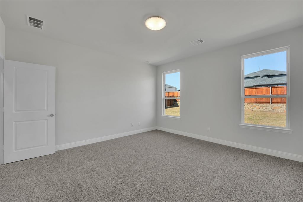 3112 Giovanni Point Princeton, TX 75407 - Photo 20 of 37 a view of an empty room with a window and closet area