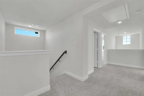 a view of an empty room with a fireplace