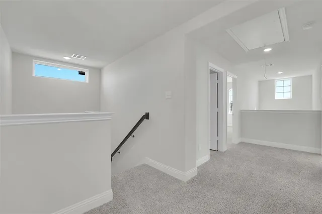 a view of an empty room with a fireplace