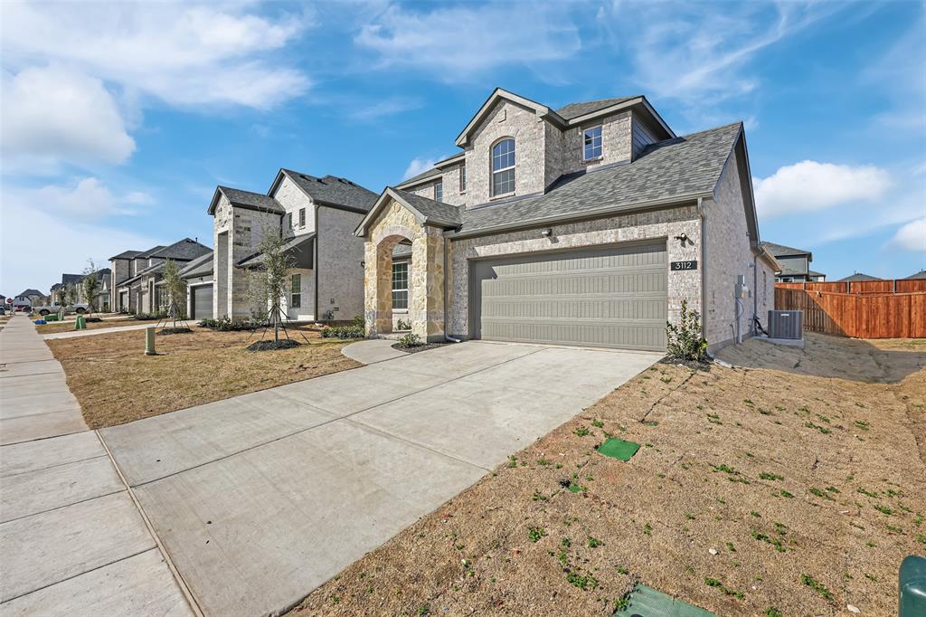 3112 Giovanni Point Princeton, TX 75407 - Photo 3 of 37 a front view of a house with a yard
