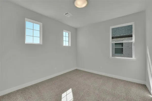 a view of empty room with windows