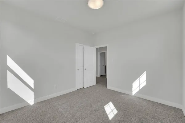 a view of empty room with windows