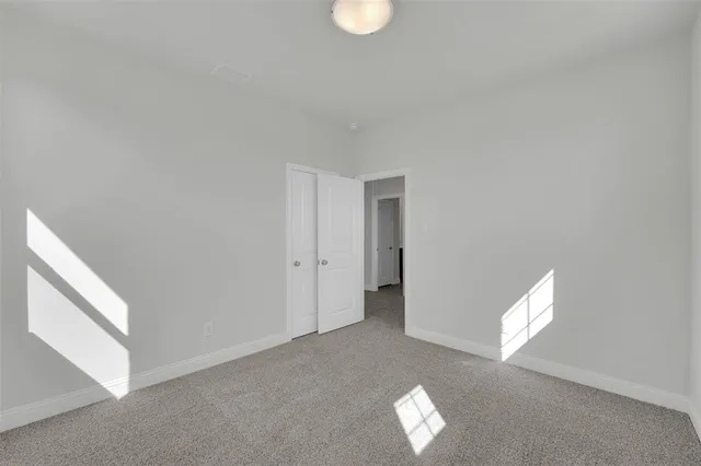 a view of empty room with windows