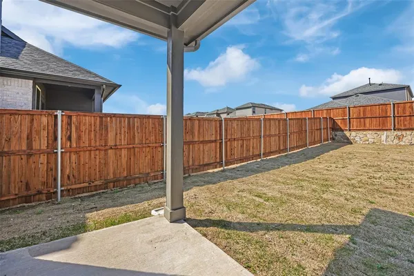 a view of outdoor space with wooden fence