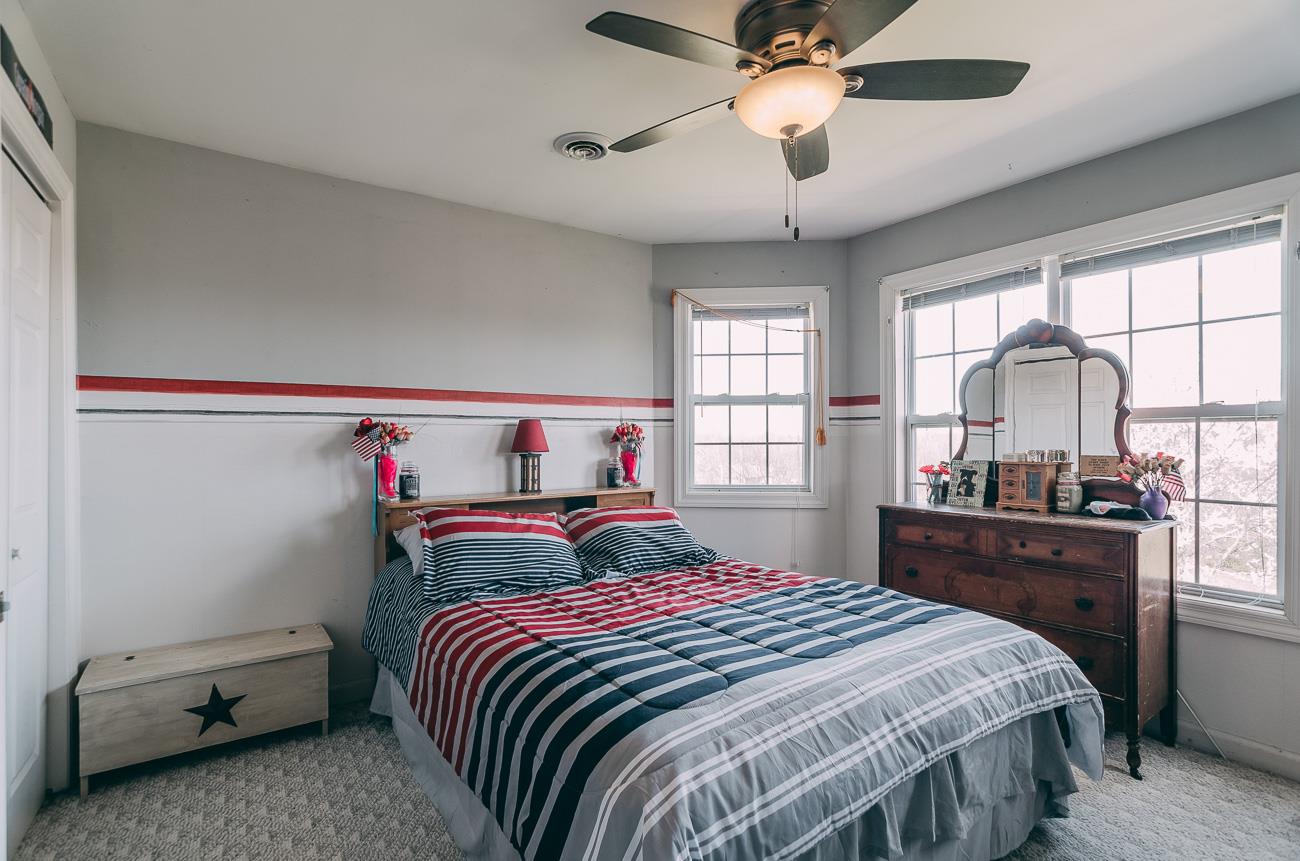 6141 Bethlehem Road Springfield, TN 37172 - Photo 13 of 30 Front bedroom upstairs overlooks the entire front of the property, which is beautiful! This room has a fourth window to the right; it is the only window in the row of windows not shown.