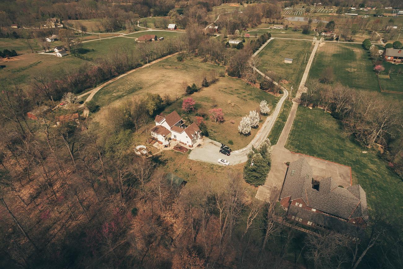 6141 Bethlehem Road Springfield, TN 37172 - Photo 27 of 30 Looking from the woods, across the back yard, over the house, down the property to the fenced in area and the two stall shelter.