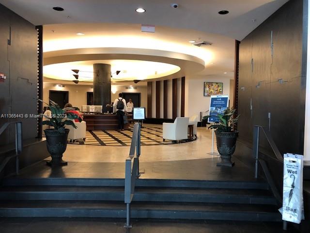 1500 Bay Road, Unit 958S Miami Beach, FL 33139 - Photo 14 of 20 a bathroom with a double vanity sink and a mirror