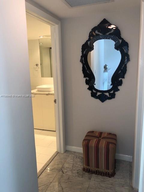 1500 Bay Road, Unit 958S Miami Beach, FL 33139 - Photo 9 of 20 a bathroom with a tub and mirror