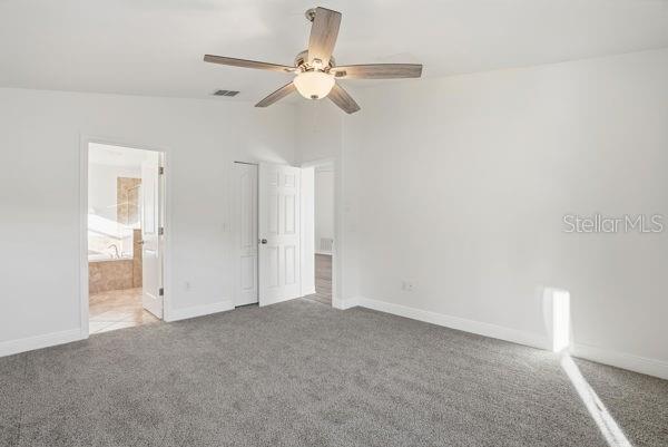 10120 Ives Loop Hudson, FL 34667 - Photo 12 of 23 an empty room with fan and entrance