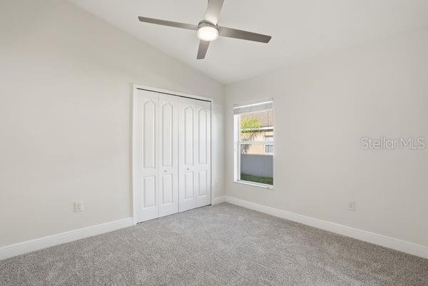 10120 Ives Loop Hudson, FL 34667 - Photo 14 of 23 an empty room with an entryway and fan
