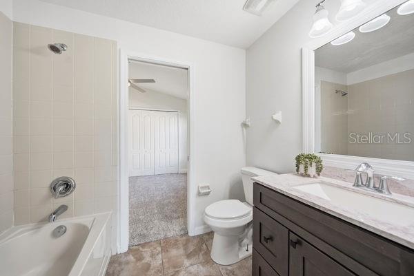10120 Ives Loop Hudson, FL 34667 - Photo 15 of 23 a bathroom with a sink a toilet and shower